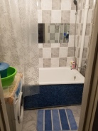 Shower! (toilet is usually separate in Russian apartments)